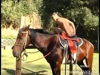 MILF with nice ass gets intimate next to her horse