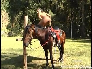 MILF with nice ass gets intimate next to her horse