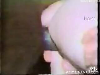 Sexy female slams huge dog dick in her ass and pussy